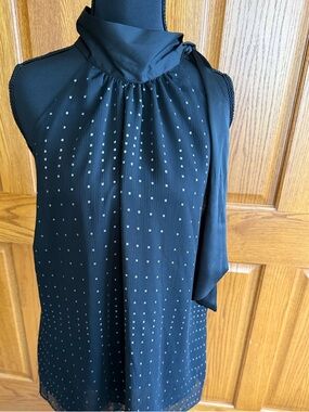 Lightweight women’s halter top in black and silver, size extra large.